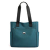 A teal nylon shoulder tote bag with black straps and a flap closure.