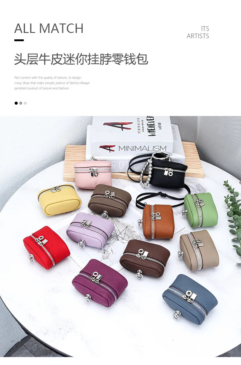 A collection of handcrafted leather neck pendant coin purses in various shades and colors displayed on a white table.