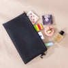 A dark blue multi-functional organizer tool kit bag is shown open, displaying various small tools and accessories on a light 