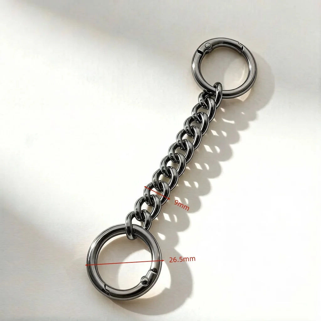 A silver metal chain extender with a loop and a ring, showing its link size and overall dimensions.