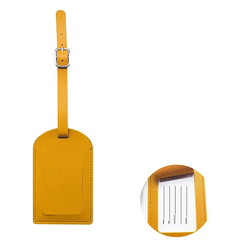 A yellow PU leather luggage tag with a metal clip and an ID card holder slot.