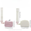 A light pink mini nylon zip wristlet coin purse shown next to its measuring tape.