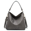 A dark gray vintage faux leather hobo shoulder bag with a long strap.