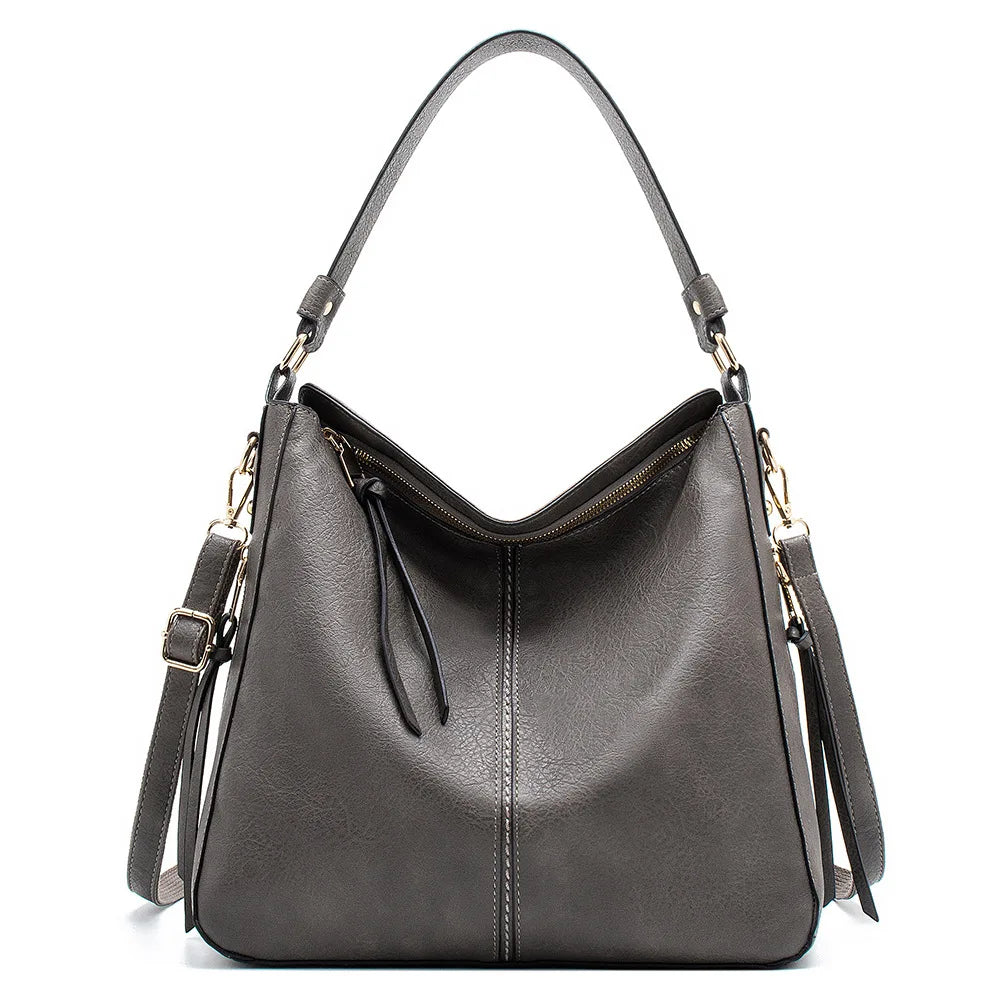 A dark gray vintage faux leather hobo shoulder bag with a long strap.