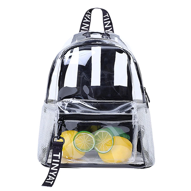 A clear plastic backpack with a black strap and mesh fabric, filled with fresh citrus fruits.