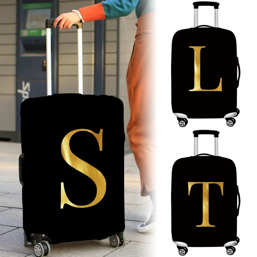 Black luggage with a gold initial S and T on the protective cover