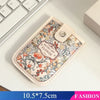 A beige PU card wallet featuring a floral pattern with red and green accents, shown on a white surface.