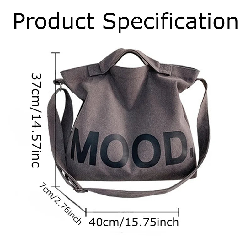 A gray canvas tote bag featuring the word MOOD printed on the front.