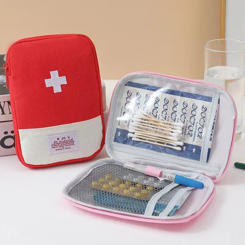A red and white portable first aid kit storage bag with an open compartment showing medical supplies.
