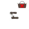 A brown leather crossbody strap with a silver clasp and a rectangular pouch.