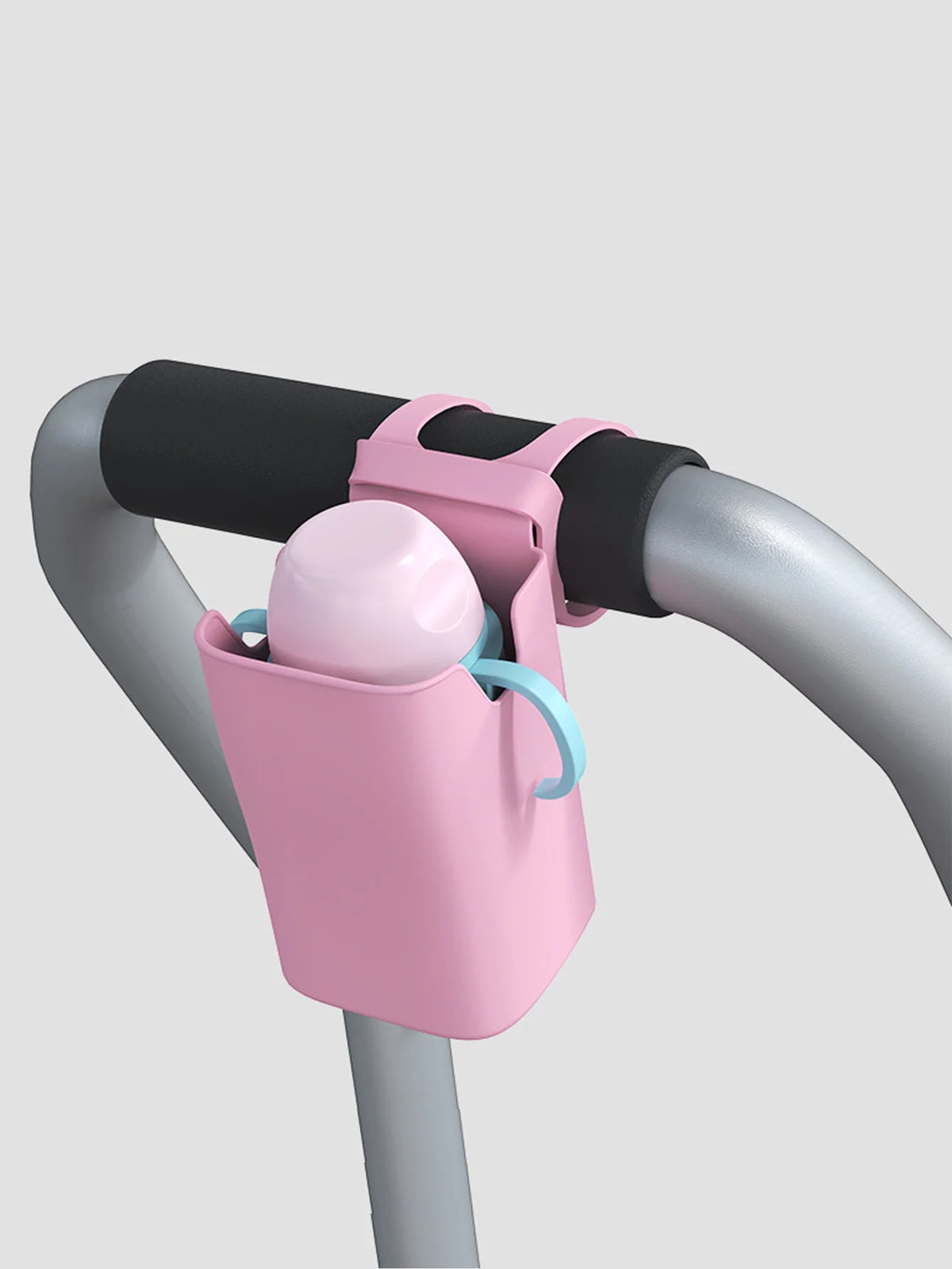 A pink silicone cup holder is mounted on a gray bicycle handlebar.