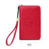 A red passport holder with a leather strap and a circular emblem is shown against a white background.