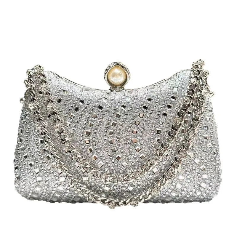 Silver rhinestone diamond inlay evening clutch bag with a pearl closure