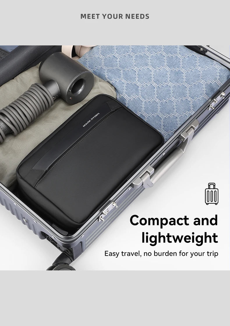A black travel toiletry organizer bag is shown inside an open suitcase with a black brush.