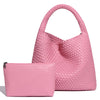 A pink handwoven faux leather tote bag and matching clutch displayed together.