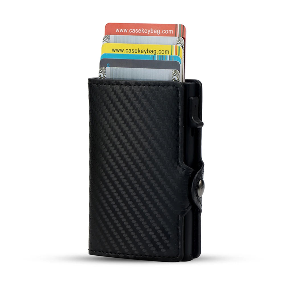 Black carbon fiber RFID pop-up card holder displaying several cards.