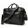 Black vintage genuine leather briefcase with a shoulder strap and brass hardware.