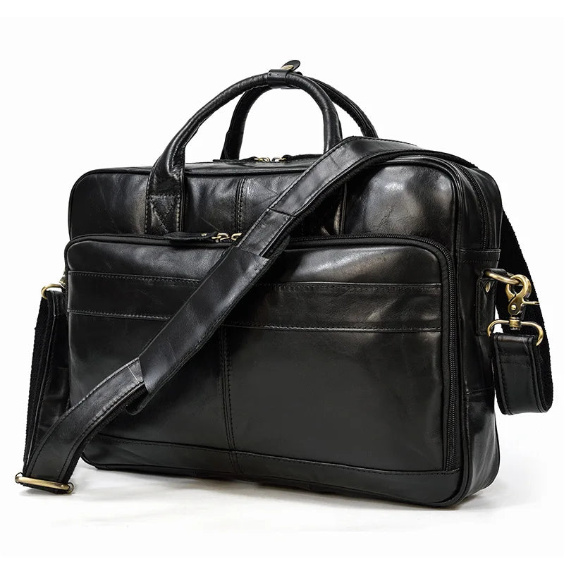 Black vintage genuine leather briefcase with a shoulder strap and brass hardware.