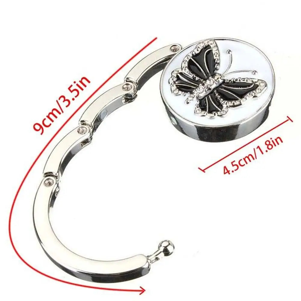 Gancho para colgar mesa de mariposa plegable de aluminio plateado con adorno de mariposa