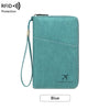 A teal leather passport and document holder with a zipper and lanyard, featuring the Charm Infinite logo.
