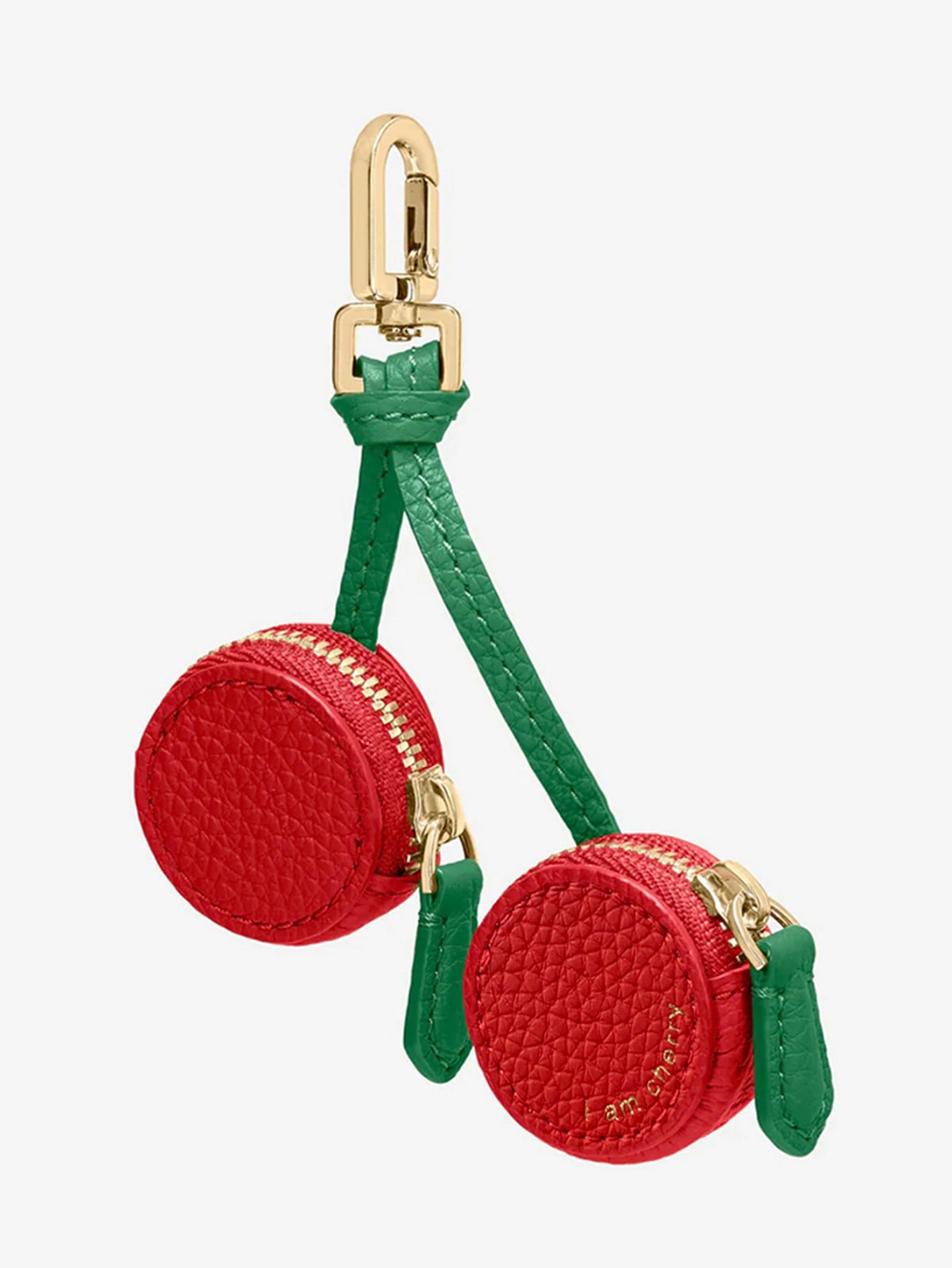 A red cherry fruit shape coin purse keychain with gold hardware and green fabric strap.