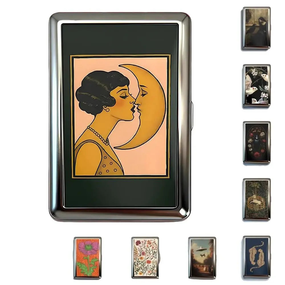 A vintage metal card holder featuring a design of two faces kissing against an orange background.