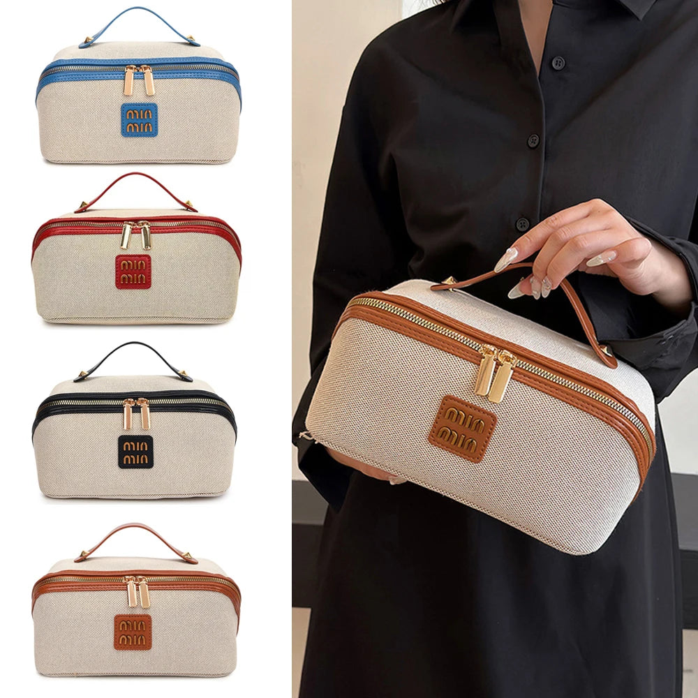 A collection of beige and brown travel toiletry bags with gold accents shown against a dark shirt.