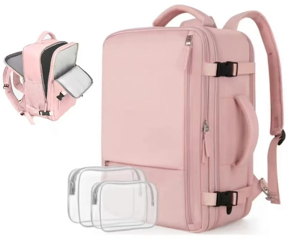 A pink 15-inch travel laptop backpack with a clear plastic sleeve visible.