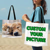 A woman holds a white tote bag with green text that reads Custom Your Picture, next to a photo of a cat and a dog.