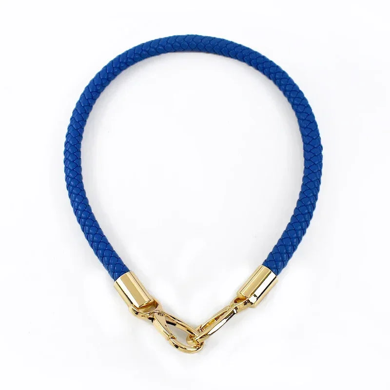 A blue PU leather replacement bag strap with gold-toned metal buckles.