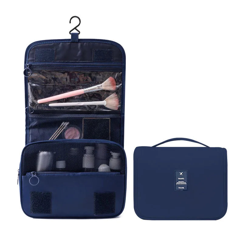 Dunkelblaue portable Reise-Toilettenorganizer-Tasche mit Reißverschluss und separatem Beutel.