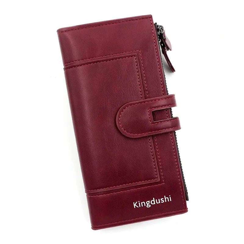 A deep burgundy leather wallet with a zipper closure and a flap design.