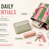 A pink and green striped knit bucket tote bag holding daily essentials like a wallet, lipstick, keys, and small mirror.