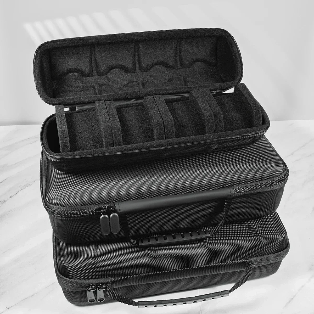 A black premium leather watch organizer travel case shown stacked on a white surface.