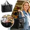 A woman holds a black reusable insulated cooler bag with a mesh insert, next to a folded bag and grocery items.