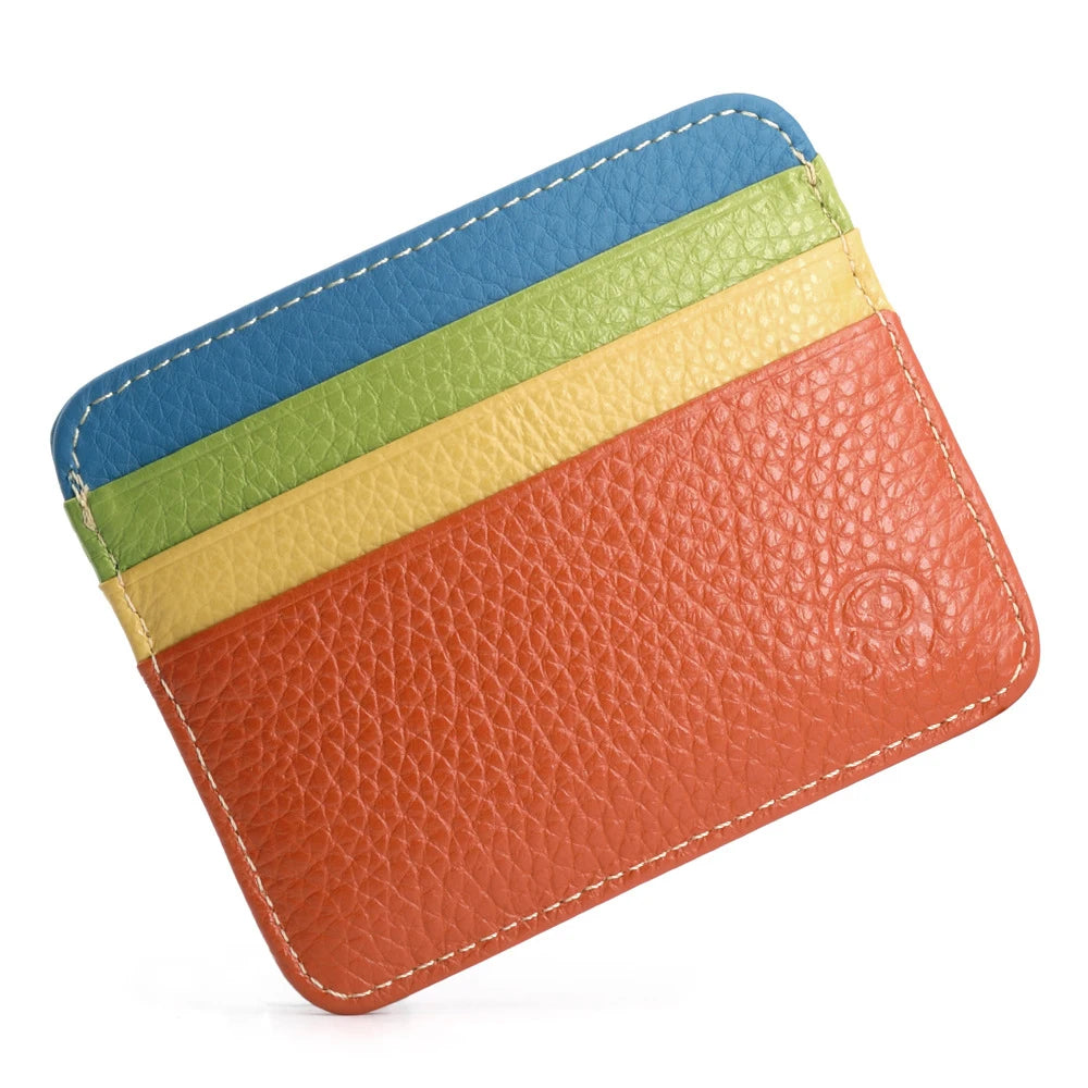 A slim card holder wallet made of genuine leather featuring horizontal stripes of blue, green, yellow, and orange.