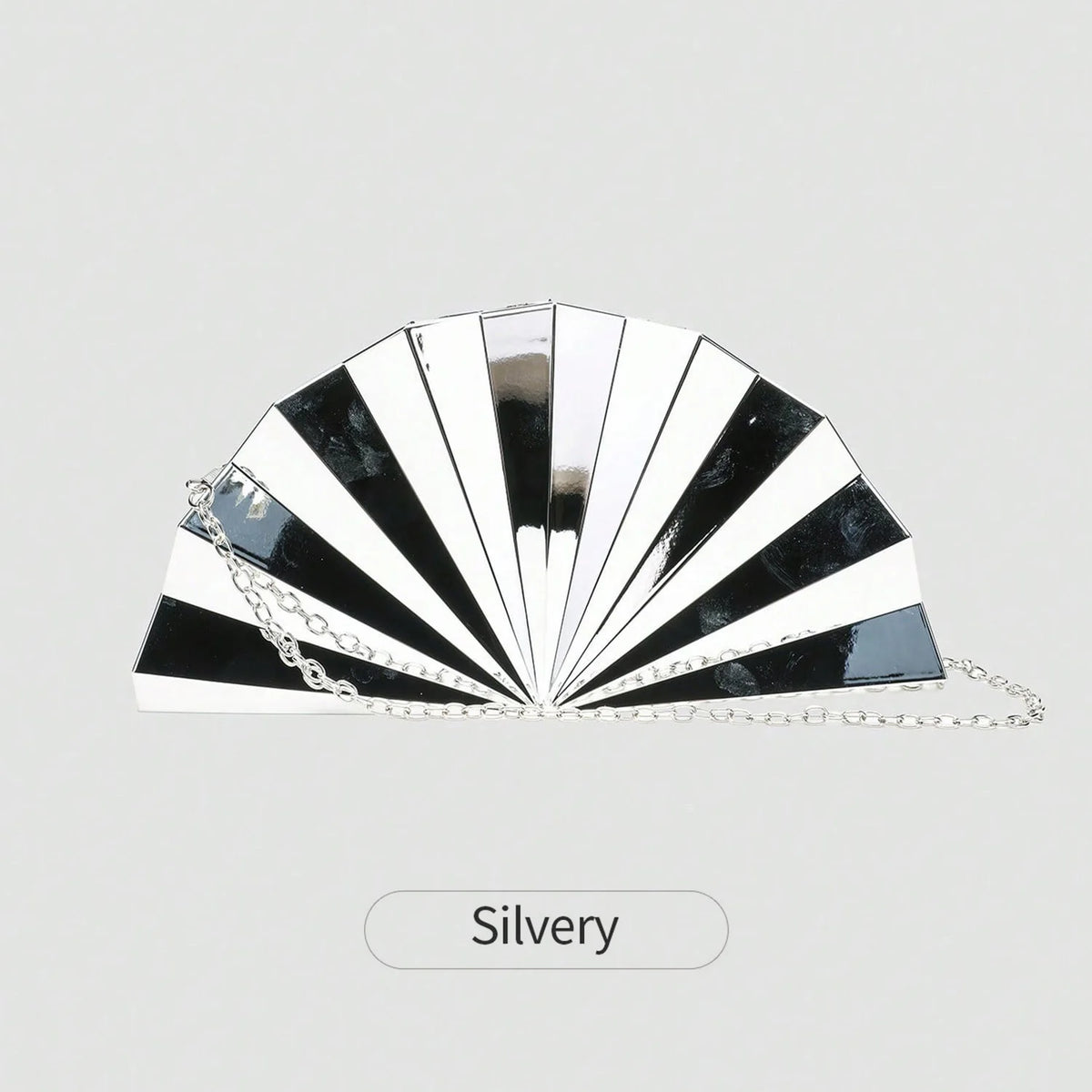 Silver acrylic chain crossbody bag with a pleated fan design featuring black and white stripes
