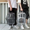 A person is holding a clear waterproof backpack in front of a light gray wall.