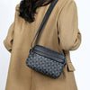 A tan blazer is shown holding a black PU leather shoulder bag with a wide strap.
