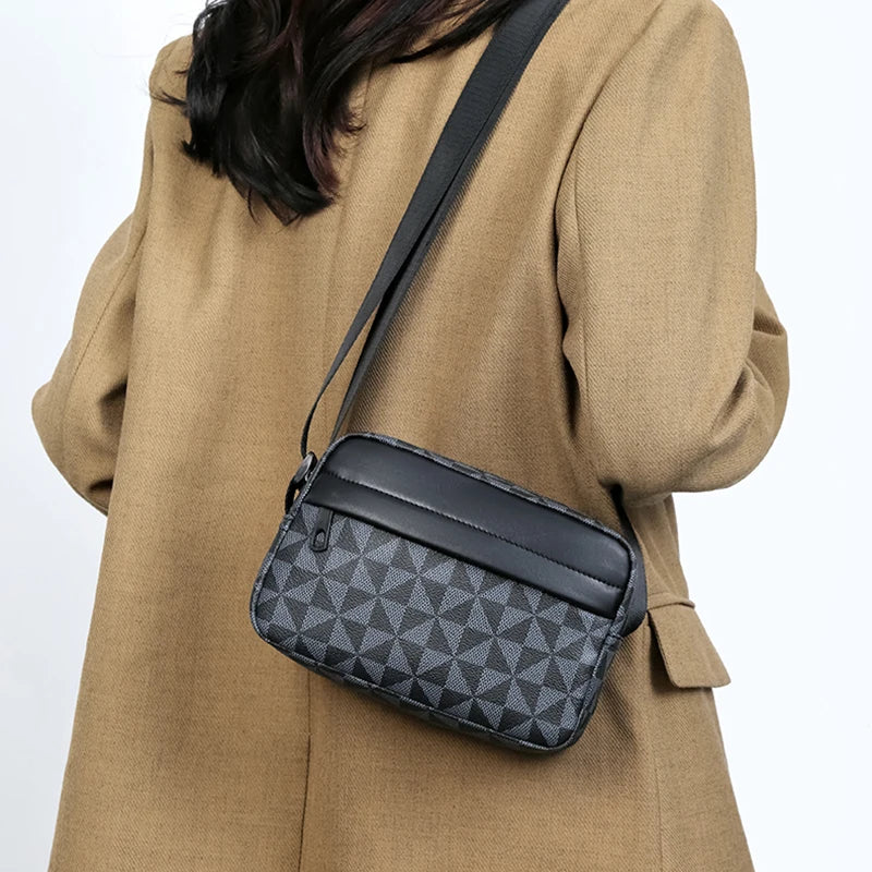 A tan blazer is shown holding a black PU leather shoulder bag with a wide strap.