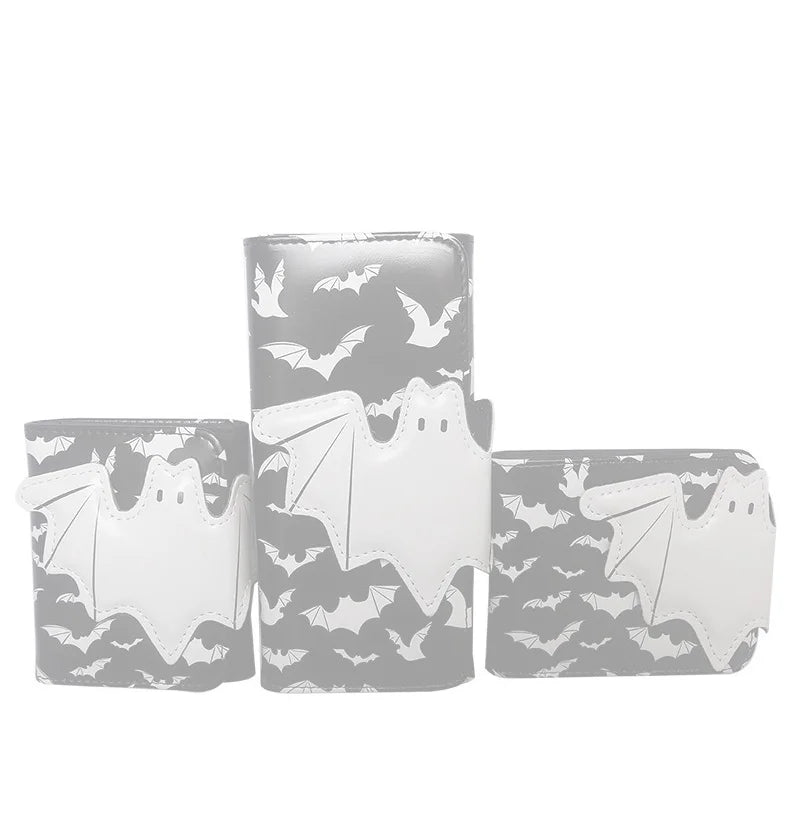 A set of three white faux leather bat print bi-fold wallets with zipper pockets.
