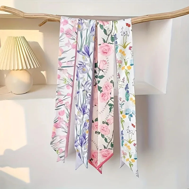 Présentation de foulards pour cheveux en soie élégants avec motifs floraux dans des tons rose, violet et vert.