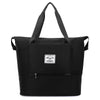 Black expandable travel organizer bag with handles and a zipper pocket