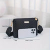 Black quilted minimalist crossbody bag with gold hardware and a white smartphone inside