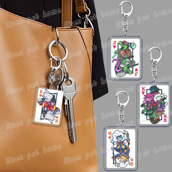 A keychain featuring Deltarune chibi poker cards attached to a brown leather handbag.