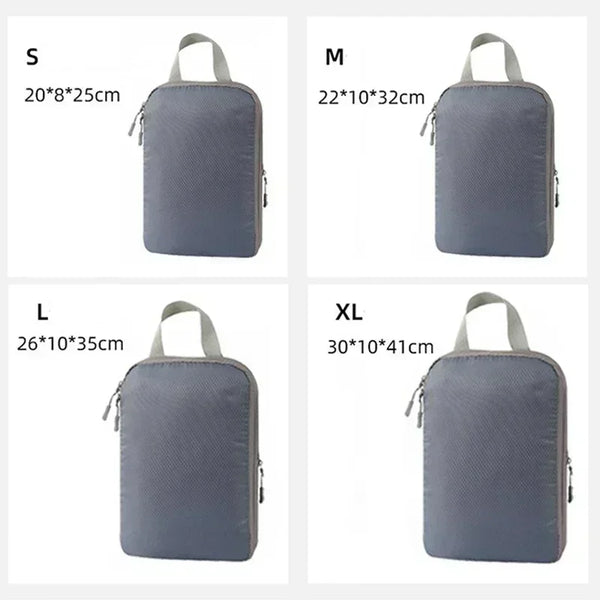 A set of four travel compression packing cubes in gray fabric, shown in sizes S, M, L, and XL.