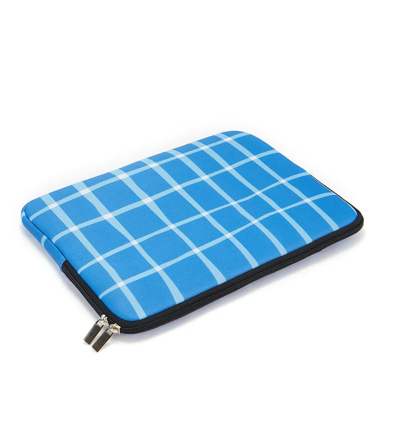 A bright blue plaid laptop sleeve with a black zipper is shown on a white background.