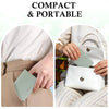 A close-up of a light green slim bi-fold wallet being held by a person, emphasizing its compact and portable design.
