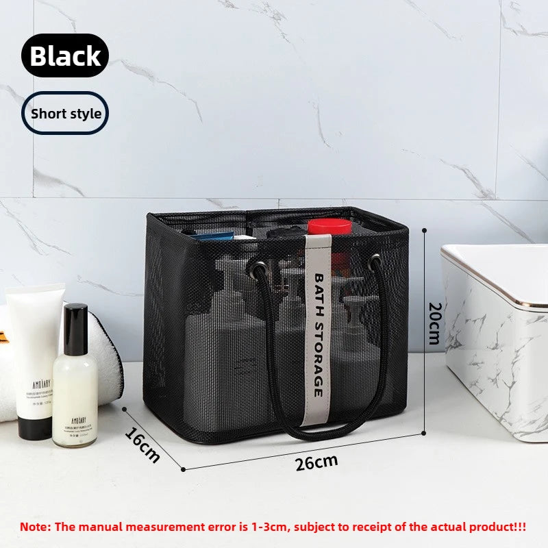 Black mesh drainage shower tote with a handle shown on a white surface.