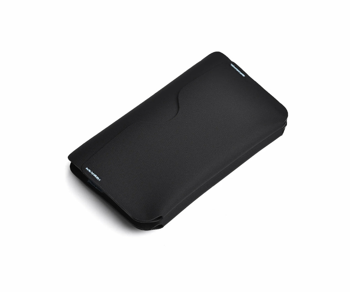 Black magnetic foldable ID card holder and coin purse shown from above.
